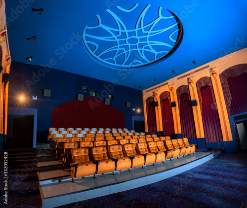 Large cinema theater with empty chair movie seats. photo