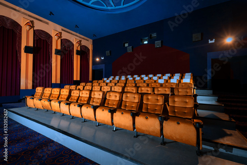 Large cinema theater with empty chair movie seats. photo