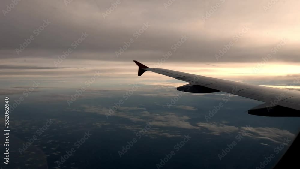 Clouds and sunshine seen from airplane window Clouds and sunshine seen from airplane window