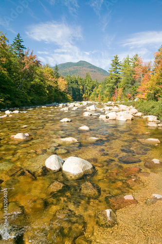 An autumn waterway along the Kancamagus Highway in the White Mountain National Forest, New Hampshire