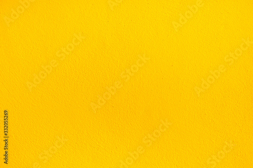 Abstract yellow concrete texture background.Orange color cement wall texture for interior design.copy space for add text.