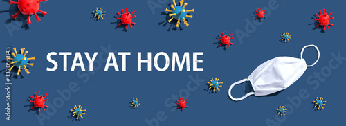Fotografie Stay at home theme with virus and a white mask - flat lay