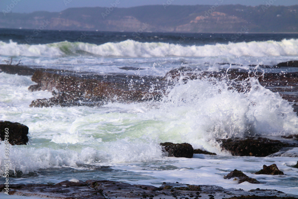 Waves Breaking on Susan Gilmore Beach at Low Tide
