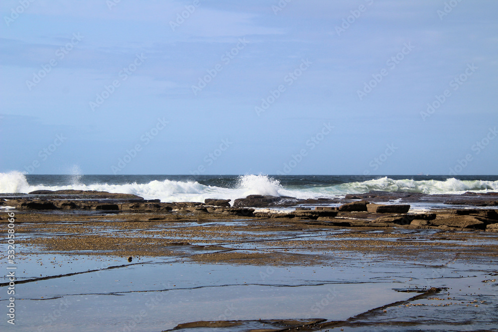 Waves Breaking on Susan Gilmore Beach at Low Tide Waves Breaking on Susan Gilmore Beach at Low Tide