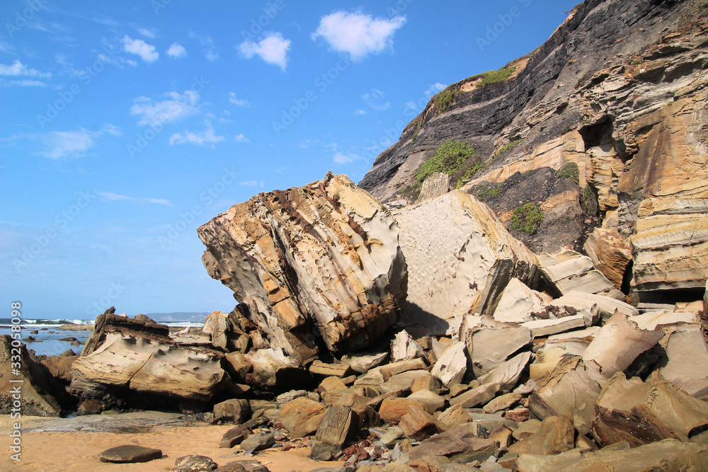 Boulder at the Bottom of a Cliff on a Beach