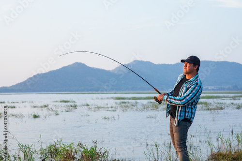 Office man self quarantine in with the nature by fishing in the lake. Quarantine concept