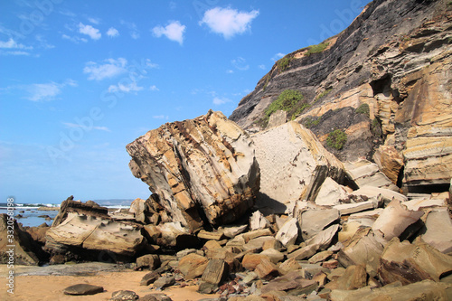 Boulder at the Bottom of a Cliff on a Beach