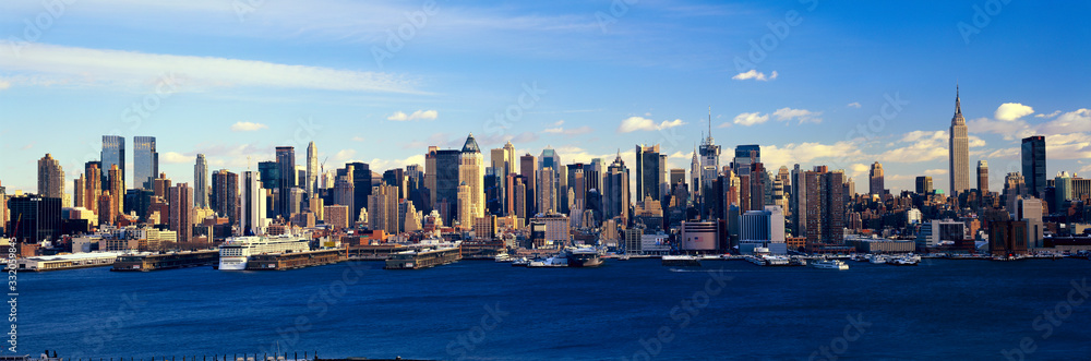 Panoramic view of Empire State Building and Manhattan, NY skyline with Hudson River and harbor, shot from Weehawken, NJ