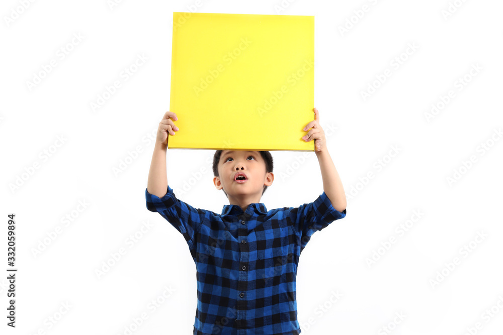 Cheerful little asian boy holding a yellow canvas board isolated on white background Cheerful little asian boy holding a yellow canvas board isolated on white background