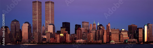 Panoramic view of lower Manhattan and New York City skyline, NY with World Trade Towers at sunset