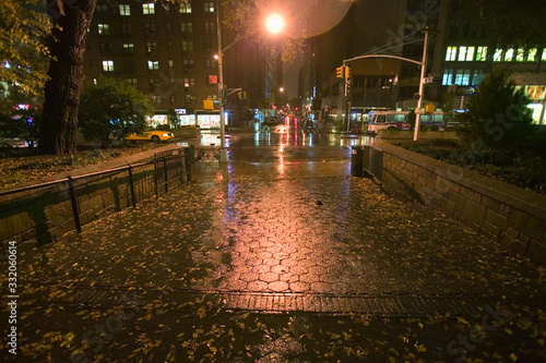 Photography Wet New York City sidewalk at night with lights, New York