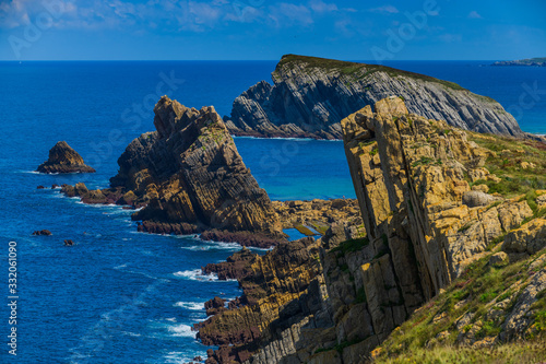 Incredible cliffs on the coast near the village of Liencres. Cantabria. Northern coast of Spain