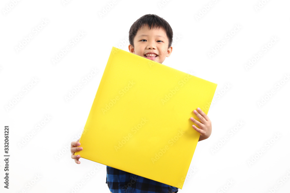 Cheerful little asian boy holding a yellow canvas board isolated on white background Cheerful little asian boy holding a yellow canvas board isolated on white background