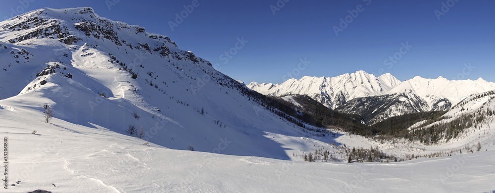 Wide Panoramic Winter Landscape of Sawback Range and Snowy Helena Mountain Peak in Banff National Park, Canadian Rockies