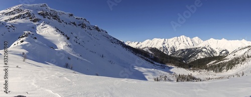 Wide Panoramic Winter Landscape of Sawback Range and Snowy Helena Mountain Peak in Banff National Park, Canadian Rockies