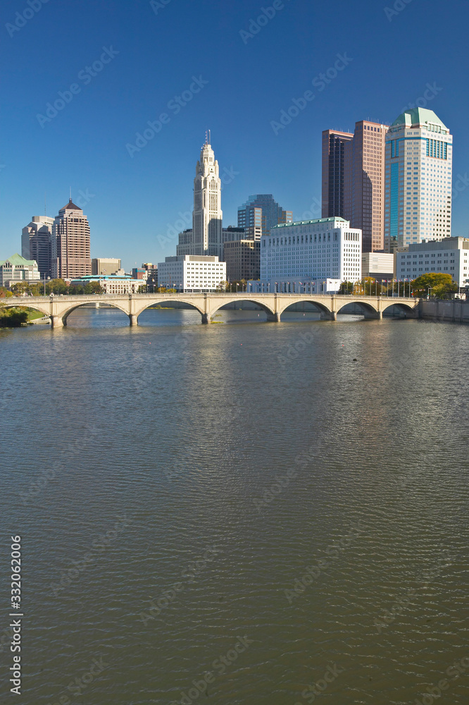 Scioto River and Columbus Ohio skyline in autumn, with setting sunlight