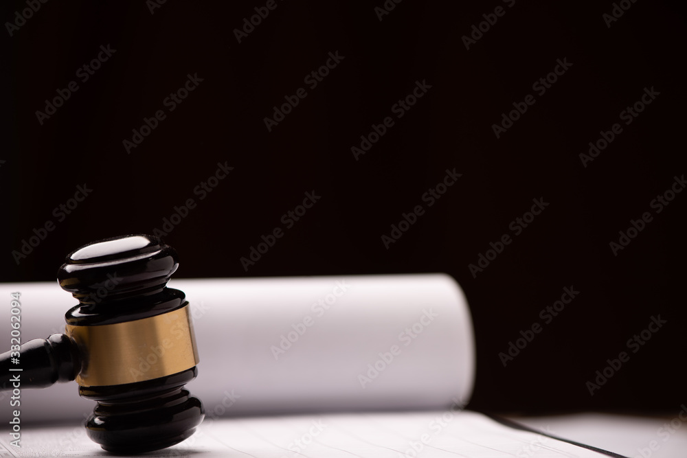 Judge`s gavel with white paper on the background.