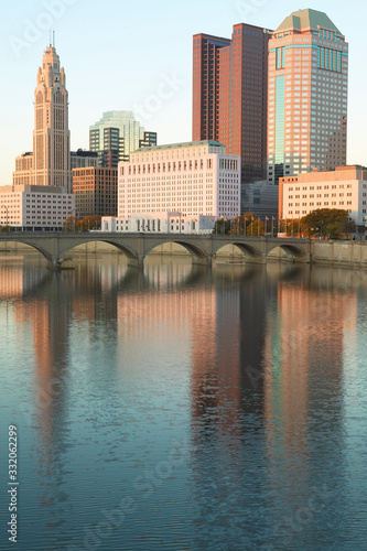 Scioto River and Columbus Ohio skyline in autumn with sunset reflection in water