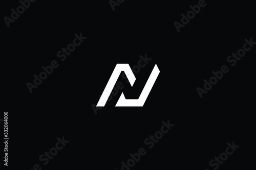 Minimal elegant monogram art logo. Outstanding professional trendy awesome artistic N NJ JN initial based Alphabet icon logo. Premium Business logo White color on black background photo