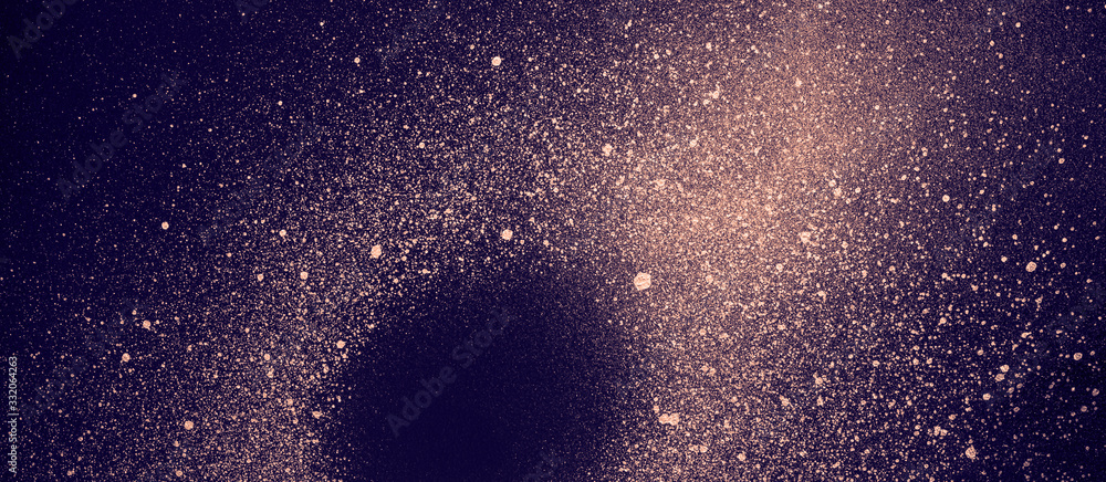 Galaxy with black hole made of gold paint spray on purple background. Abstract cosmos banner Galaxy with black hole made of gold paint spray on purple background. Abstract cosmos banner