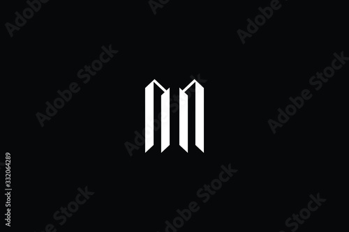 Minimal elegant monogram art logo. Outstanding professional trendy awesome artistic MN NM initial based Alphabet icon logo. Premium Business logo White color on black background