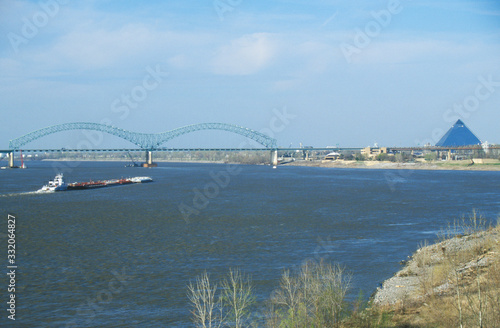 Barge on Mississippi River with Bridge and Memphis, TN in background