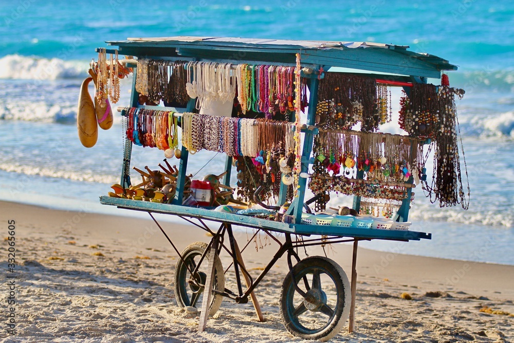 Jewelry cart on Cuban beach built on a bike Rob Lajeunesse Foto Poster Wandbilder bei EuroPosters