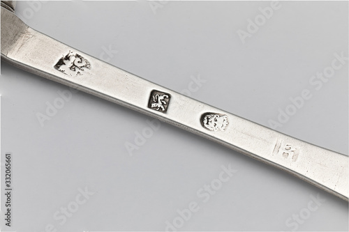 Bild auf Leinwand Detail close up macro of hallmarks on a 17th Century sterling silver trefid or trifid spoon dated 1687
