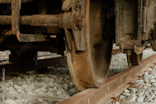 Close-up of Rusty Vintage Train Wheel and Track