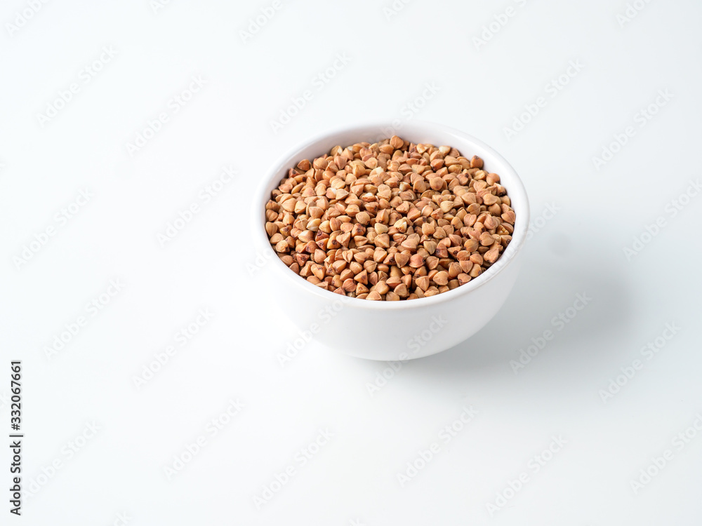 Plate with buckwheat isolated on white background. Plate with buckwheat isolated on white background.