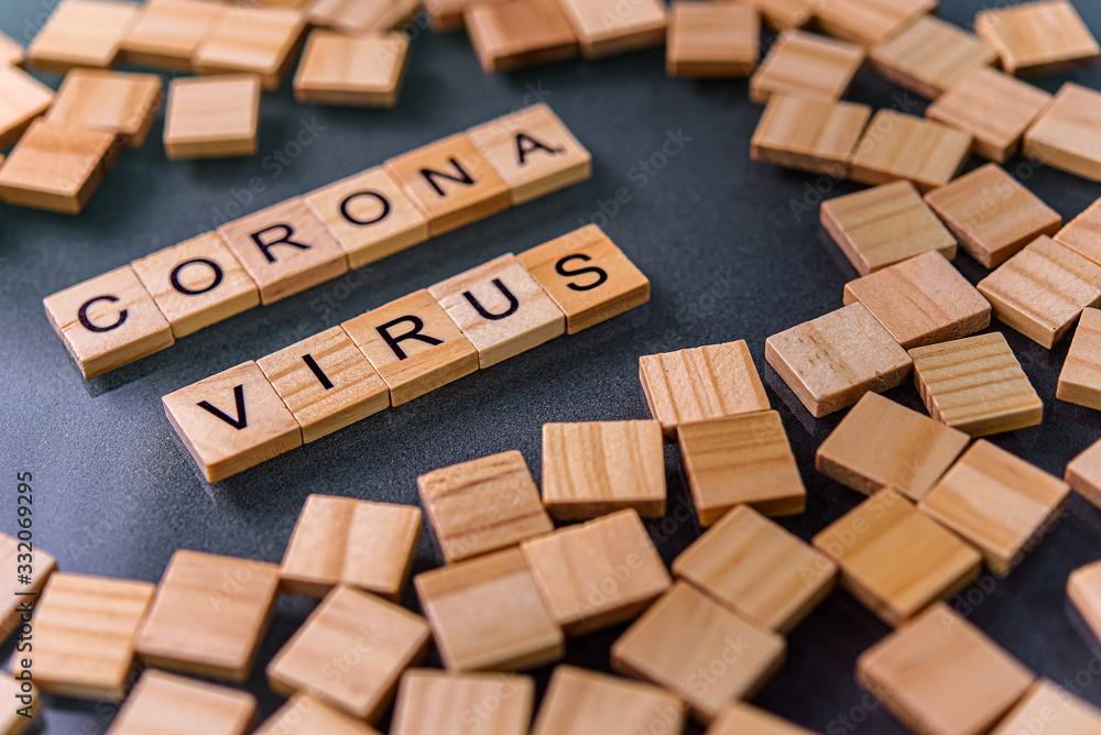 Corona virus wooden text on the black table