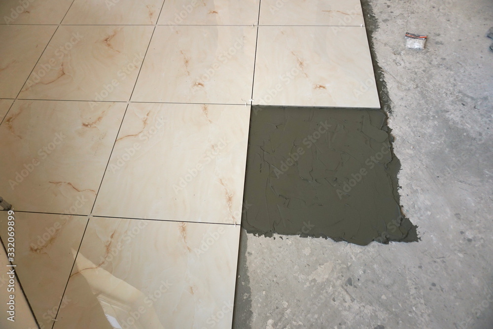 Fototapeta premium Ceramic Tiles. Floor Tiles Installation