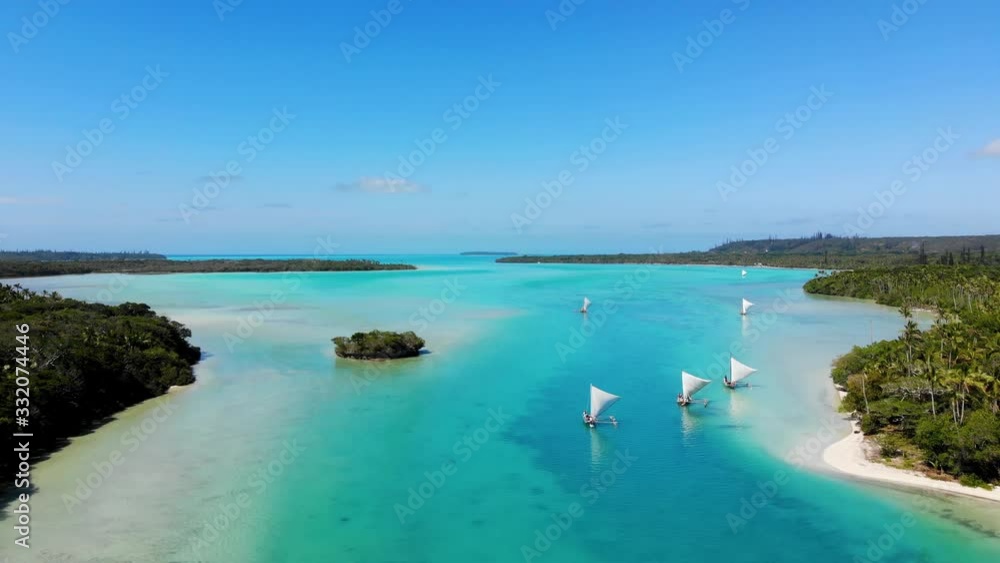 The bay of Upi in New Caledonia with the typical boats of the Kanak people. Isle of Pines. The bay of Upi in New Caledonia with the typical boats of the Kanak people. Isle of Pines.