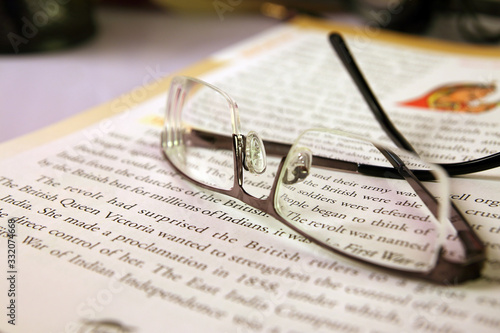 Wallpaper Mural Indian made Reading glasses on book Torontodigital.ca