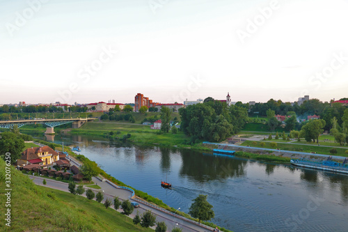 View of the Neman river and the city during sunset on a summer day.