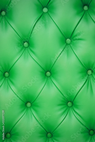 Vertical background of green leather furniture upholstery