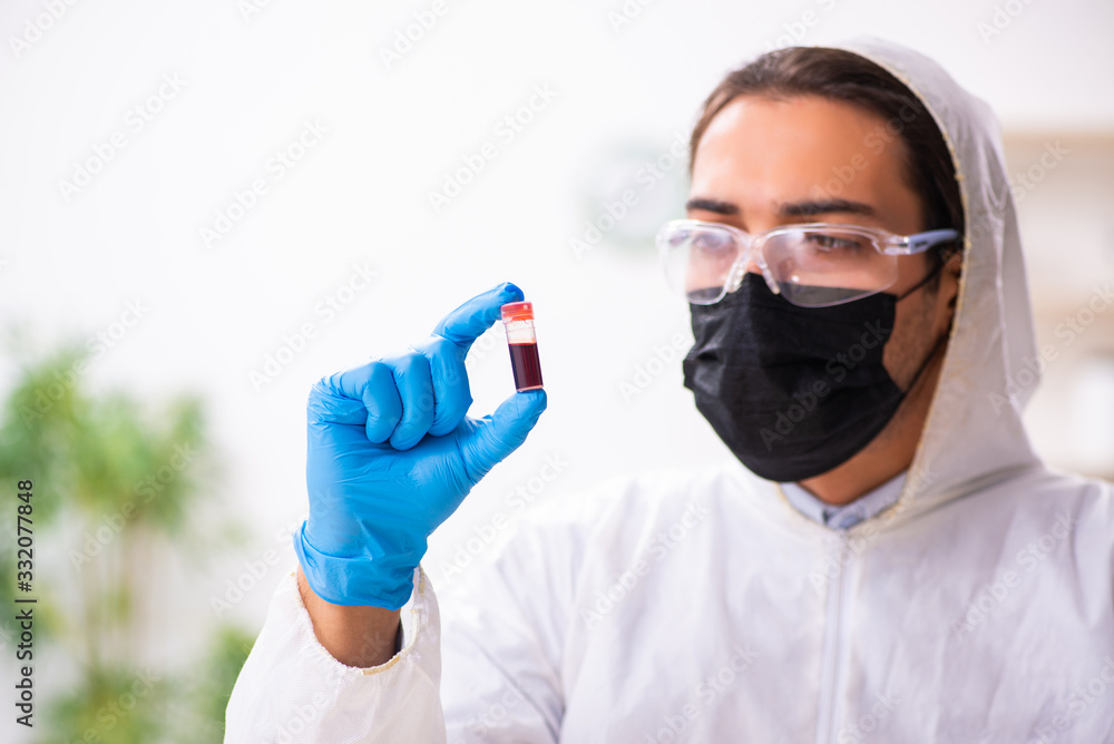 Male expert criminologist working in the lab for evidence Male expert criminologist working in the lab for evidence