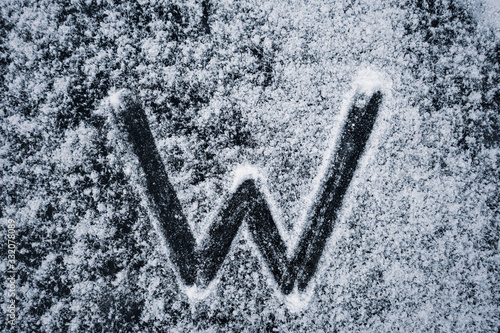  The letters of the English alphabet painted on the ice of a frozen lake photo