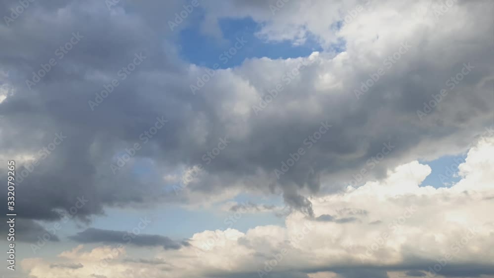 Summer sky rain cloud time lapse in the mid afternoon. fast moving cloud formations. dense thick clouds. Summer sky rain cloud time lapse in the mid afternoon. fast moving cloud formations. dense thick clouds.