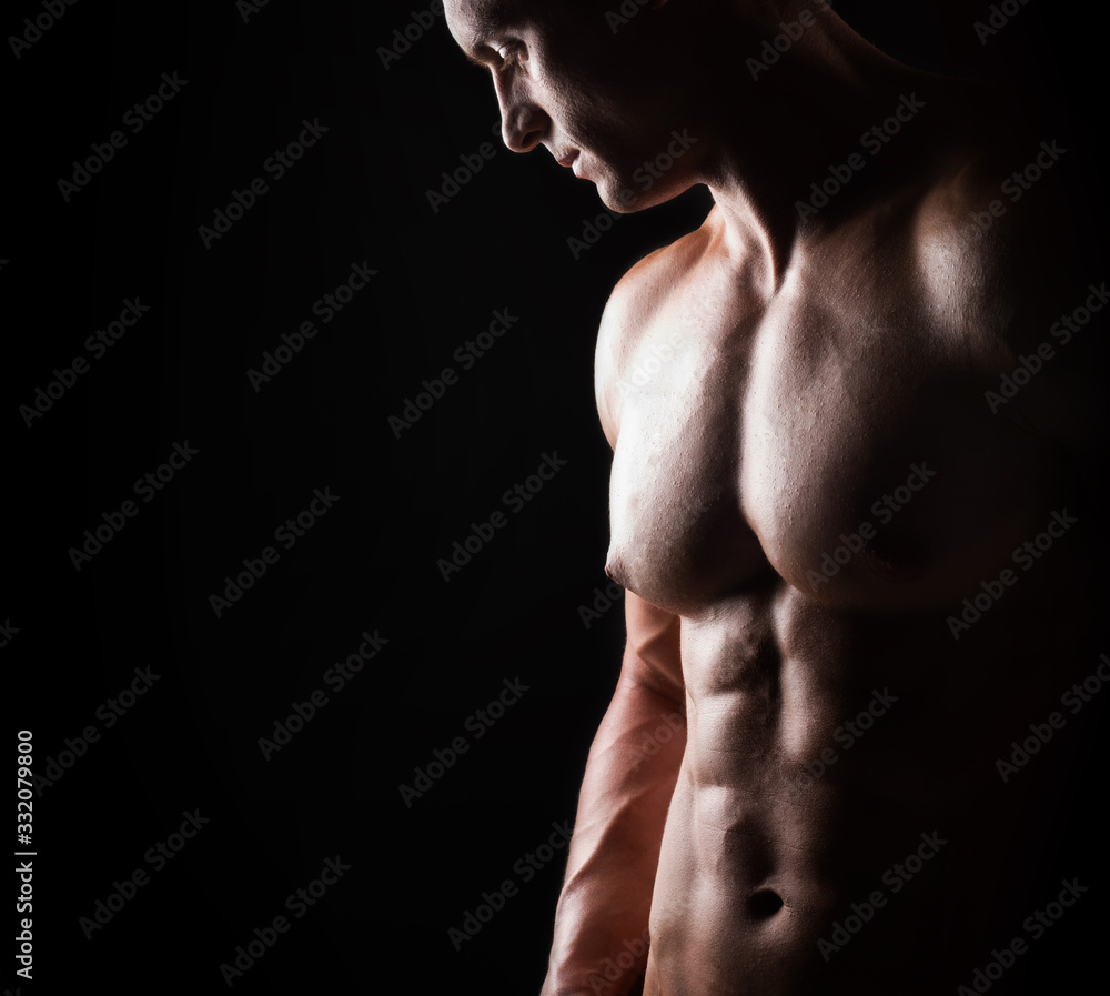 Strong, fit and sporty bodybuilder man over black background. Strong, fit and sporty bodybuilder man over black background.