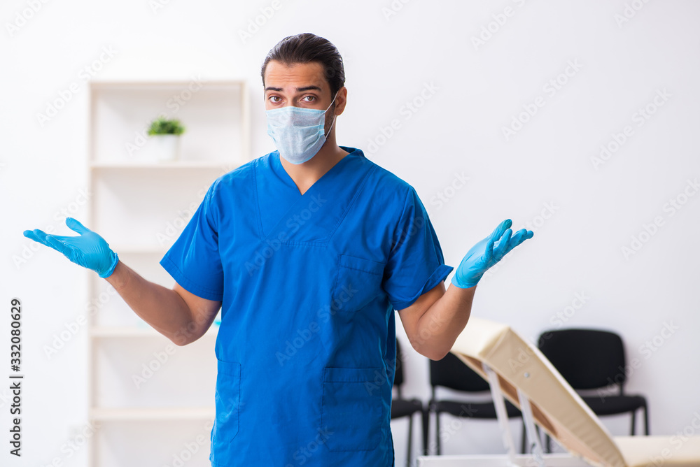 Young male doctor working in the clinic Young male doctor working in the clinic