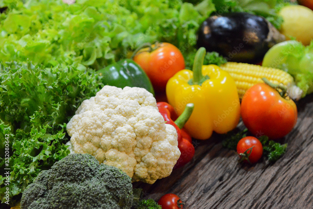 Mixed Vegetables and Salads on wooden Background.Select focus on cauliflower. Mixed Vegetables and Salads on wooden Background.Select focus on cauliflower.