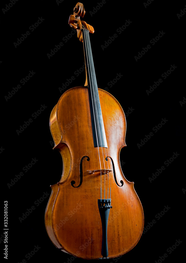Low key image of an antique cello Low key image of an antique cello