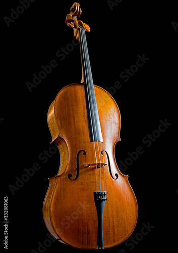 Low key image of an antique cello