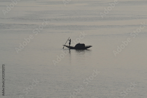 Boat on Hugli River from Howrah Bridge in Kolkata photo