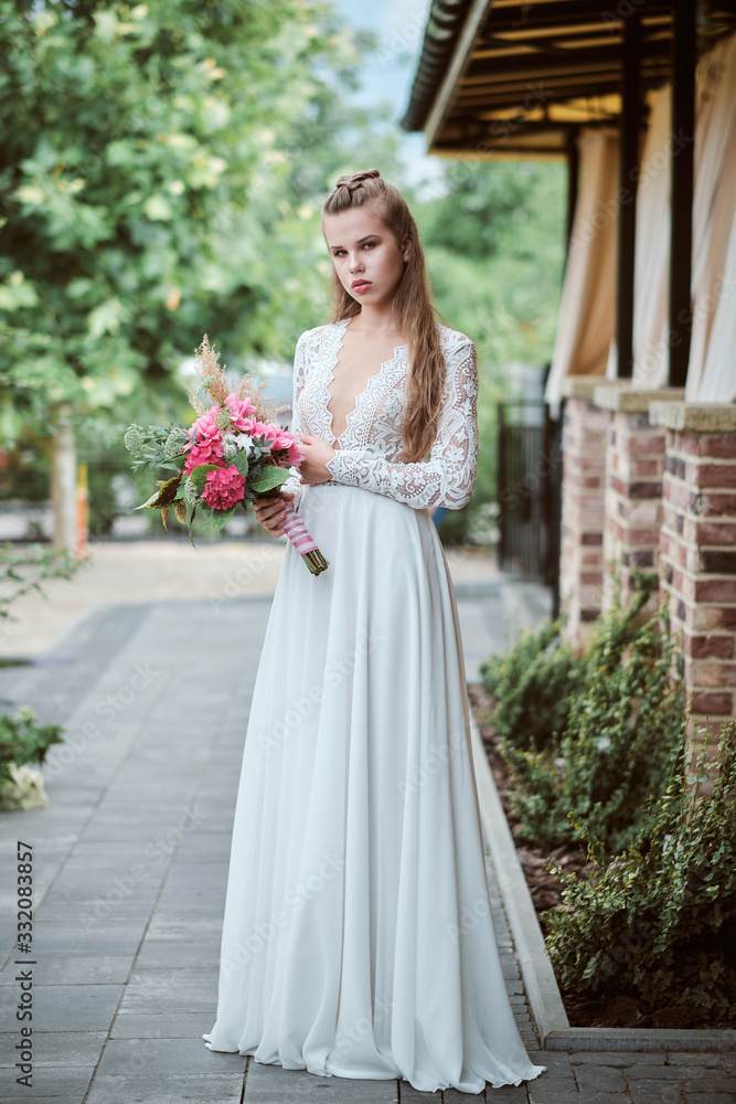 Portrait of young happy bride with bouquet Portrait of young happy bride with bouquet