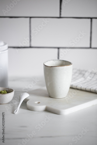 Simple rustic handmade mugs on marble table