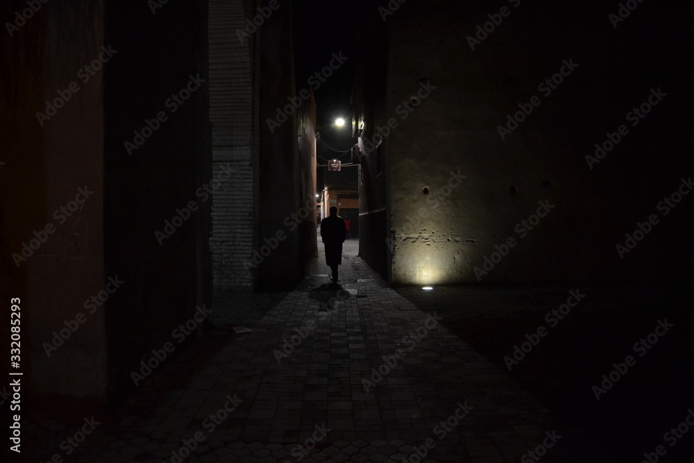 Someone walking in the night in Marrakech
