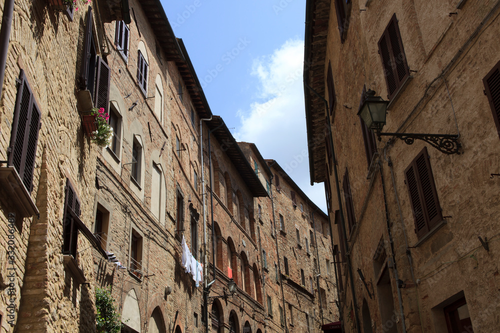 Volterra (SI), Italy - April 25, 2017: Typical houses in centre of Volterra, Tuscany, Italy