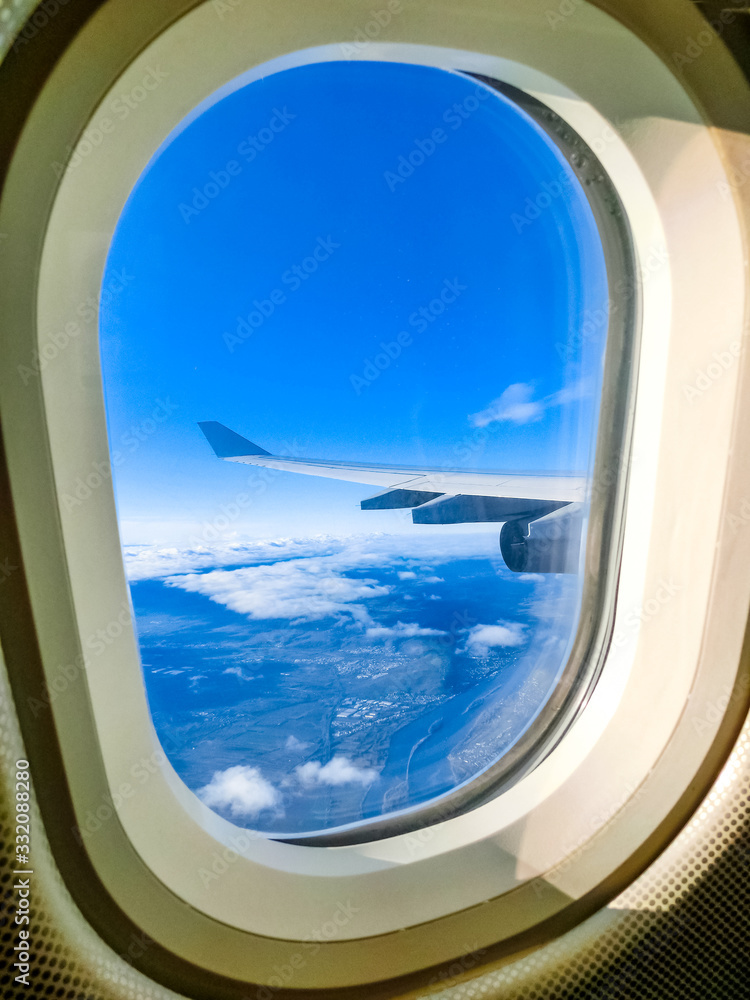 View from an airplane on a blue sky and white clouds. View from an airplane on a blue sky and white clouds.